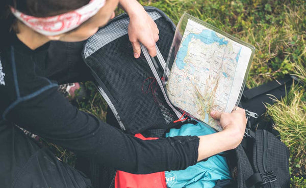 A person packing a map into the Hero's Journey.
